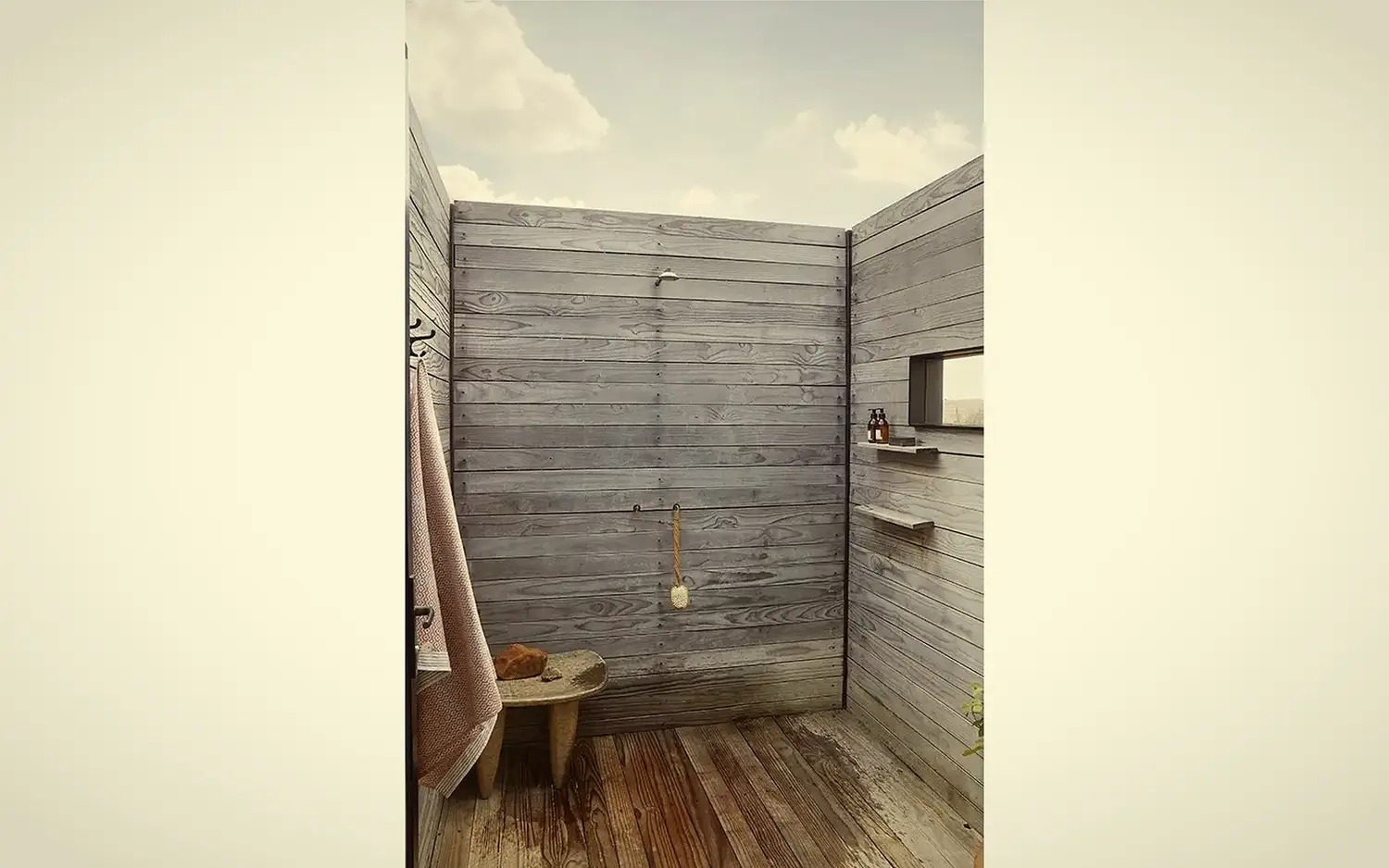 Outdoor shower · weathered timber walls open to the sky