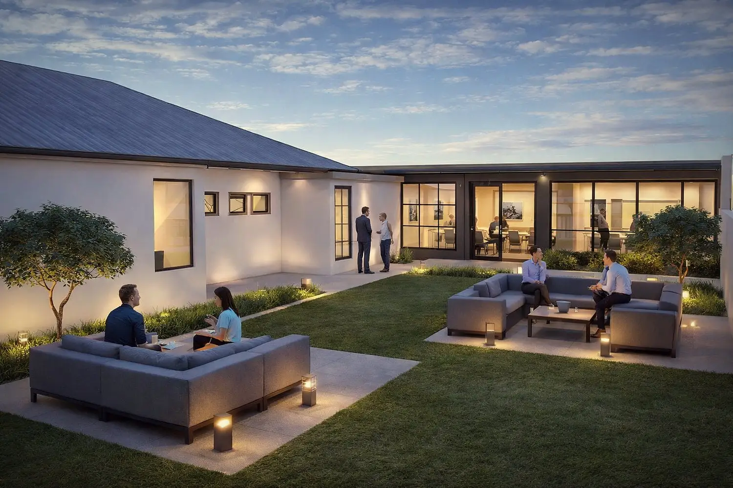New Office · internal courtyard at dusk with seating and lighting